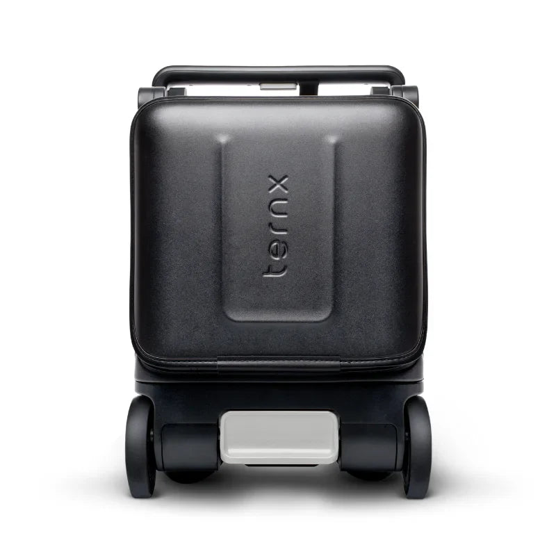 TernX Carry On Luggage Stroller i hopfällt läge som en kompakt resväska, perfekt för att passa i bagagehyllan på flygplan.