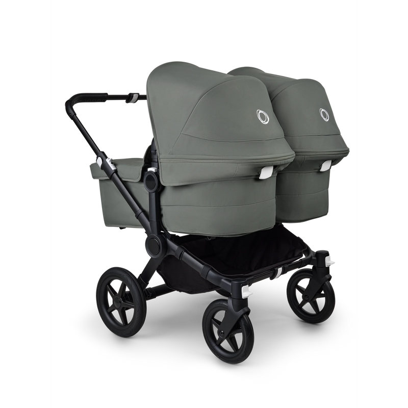 Baksidan av barnvagnen Bugaboo Donkey 5 Twin för tvillingar i skogsgrön med två liggdelar