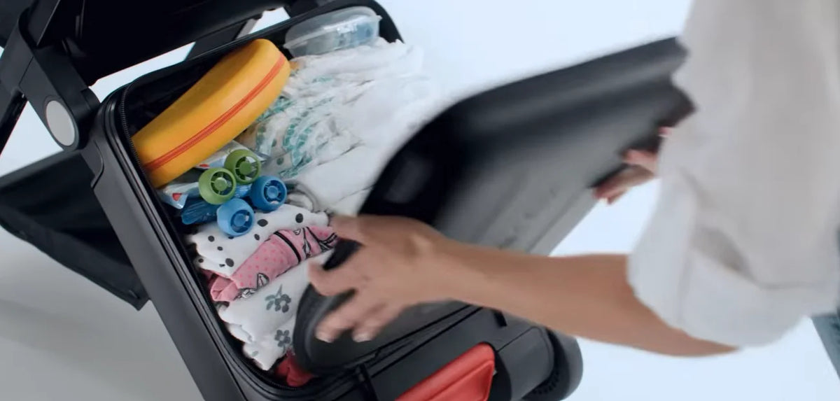 TernX Carry On Luggage Stroller packad med barnartiklar